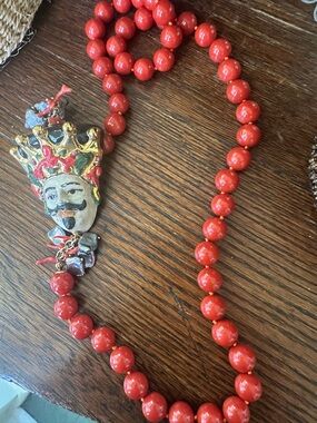 Red Beaded Necklace with Decorative King Face Pendant